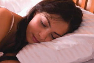 woman sleeping on a feather pillow